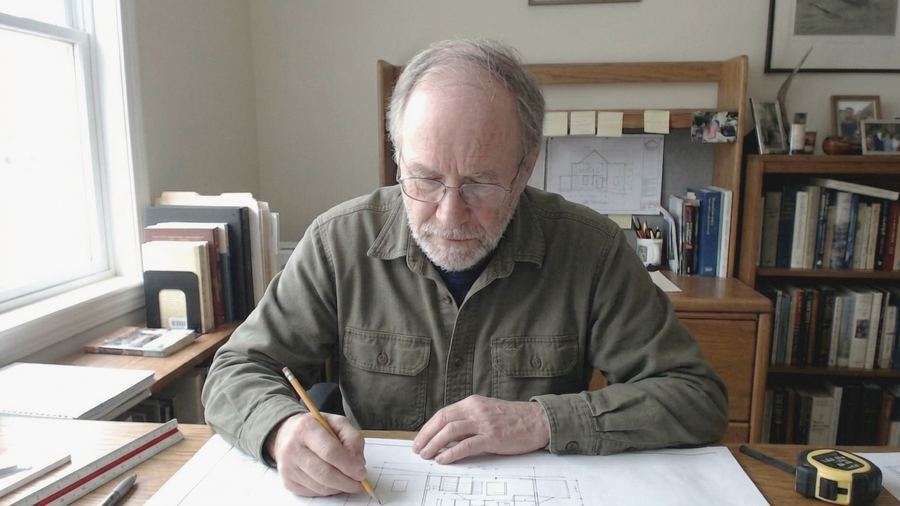 Tom Bennett working at a desk