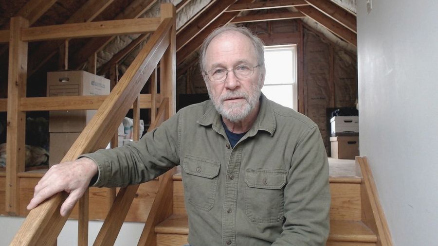 Tom Bennett at an attic landing